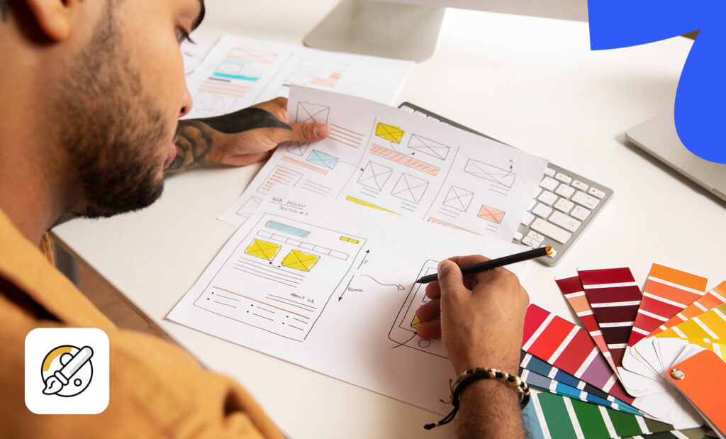 Designer reviews website wireframes and color swatches to make a SaaS brand stand out